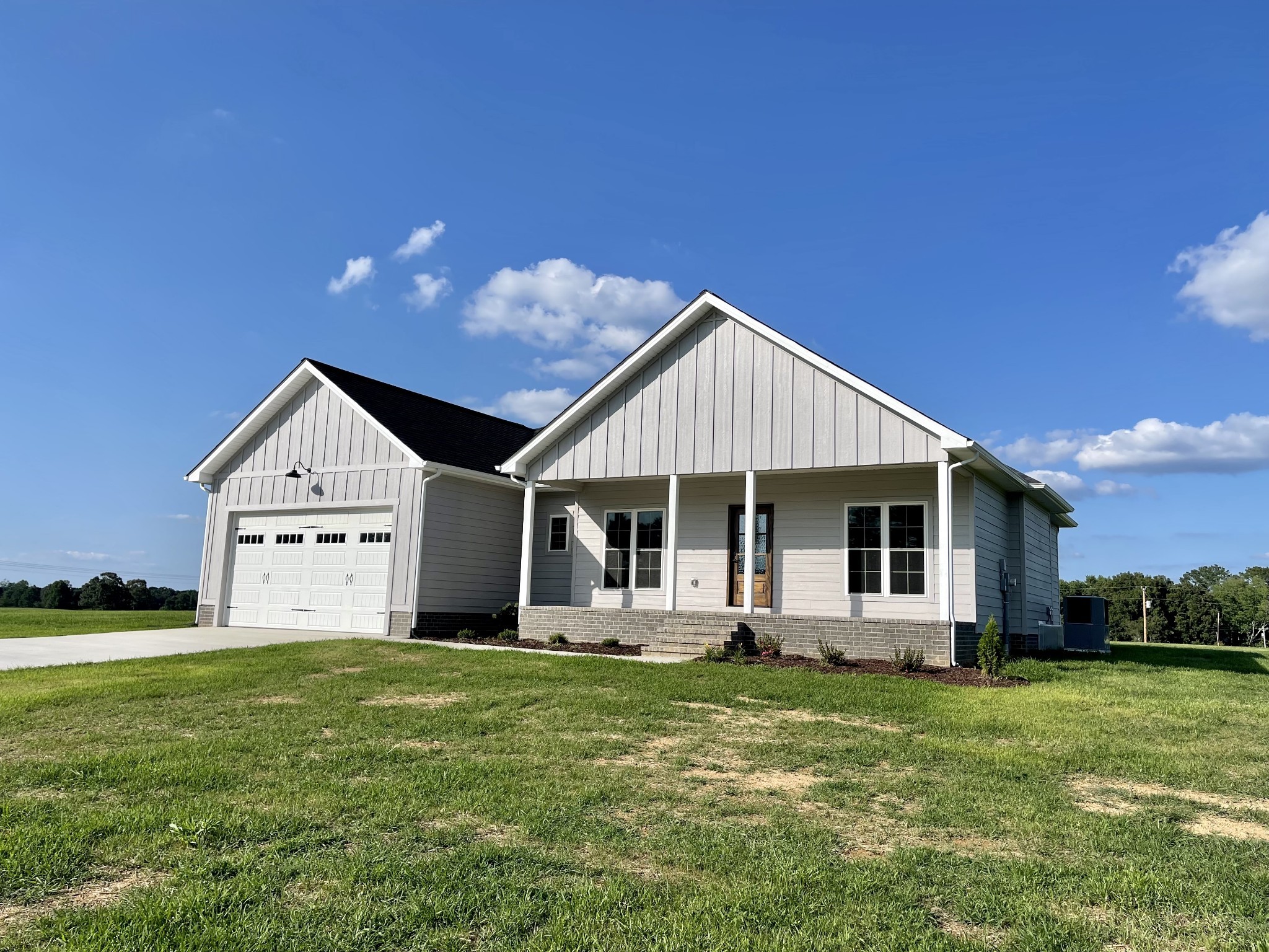 1460 Fall River Road Lawrenceburg, TN 38464 - Photo 1 of 31 a front view of a house with garden