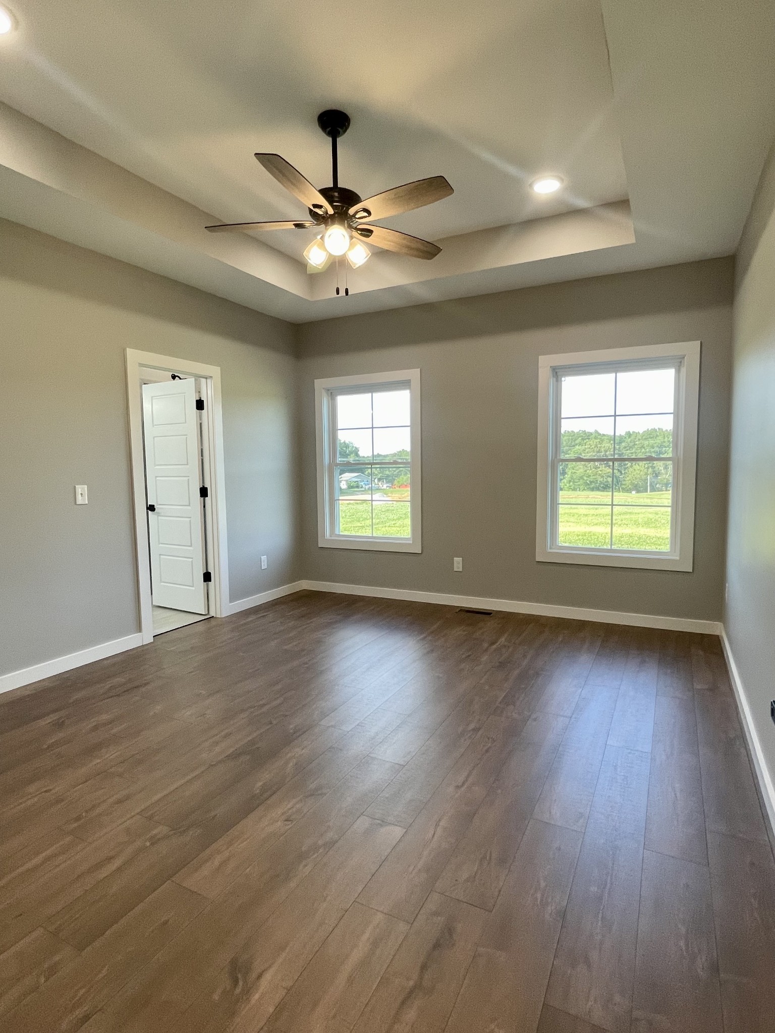 1460 Fall River Road Lawrenceburg, TN 38464 - Photo 12 of 31 a view of an empty room with wooden floor and a window