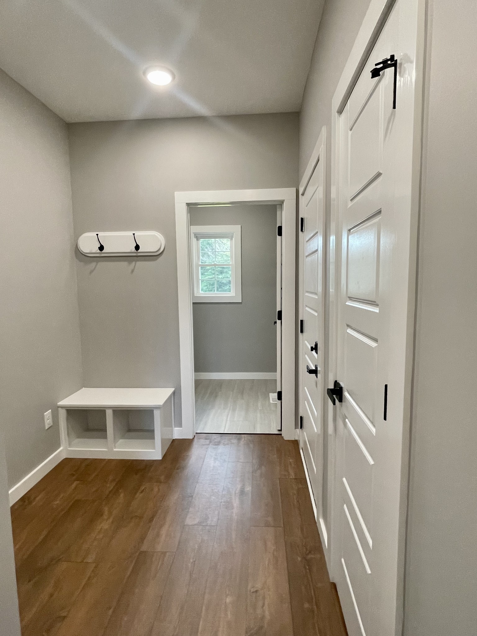 1460 Fall River Road Lawrenceburg, TN 38464 - Photo 17 of 31 a view of a hallway with wooden floor and a bathroom