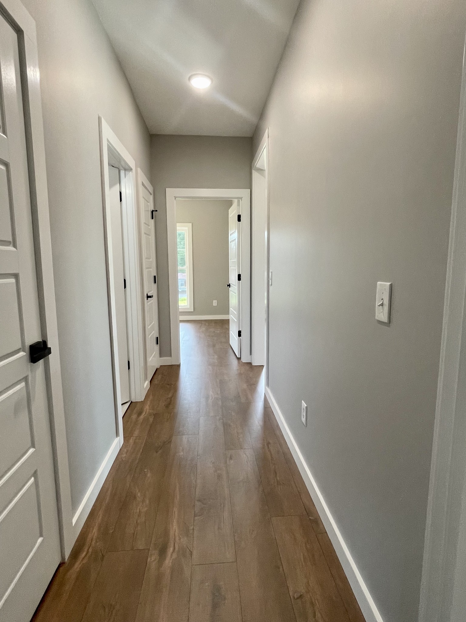 1460 Fall River Road Lawrenceburg, TN 38464 - Photo 20 of 31 a view of a hallway with wooden floor