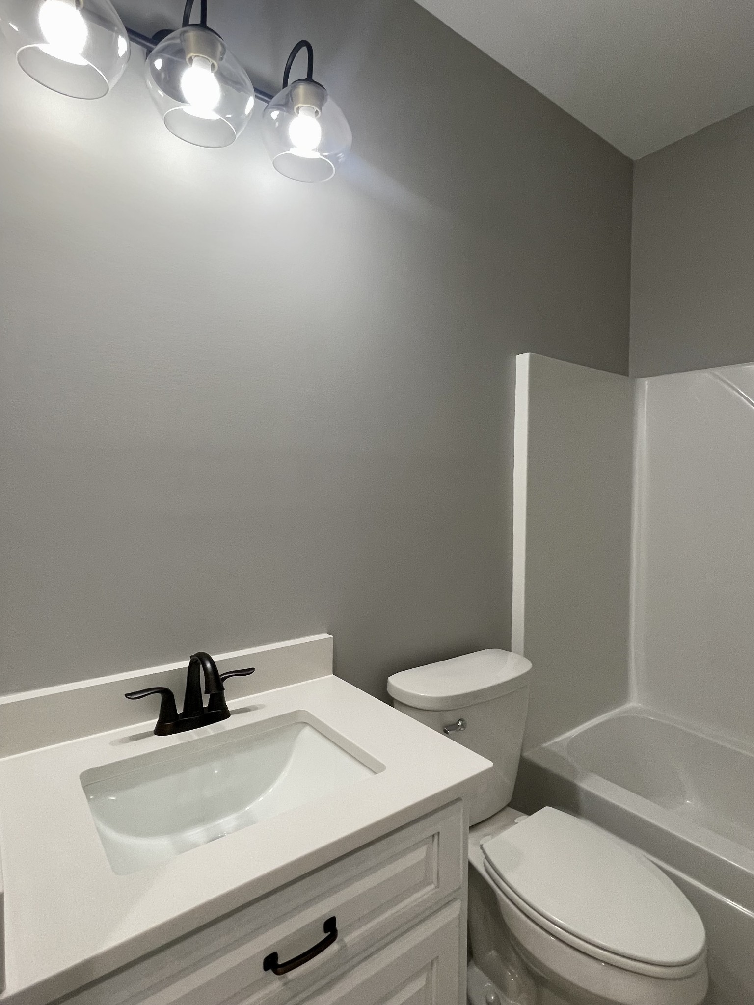 1460 Fall River Road Lawrenceburg, TN 38464 - Photo 25 of 31 a bathroom with a sink a toilet and shower