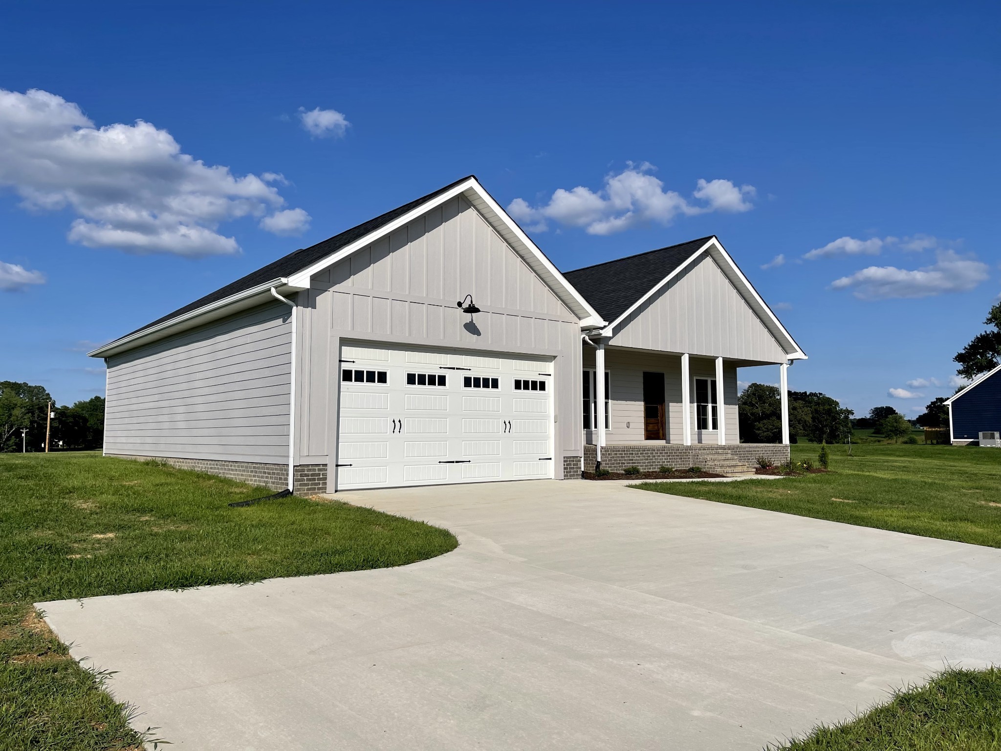 1460 Fall River Road Lawrenceburg, TN 38464 - Photo 30 of 31 a front view of a house with a yard and garage