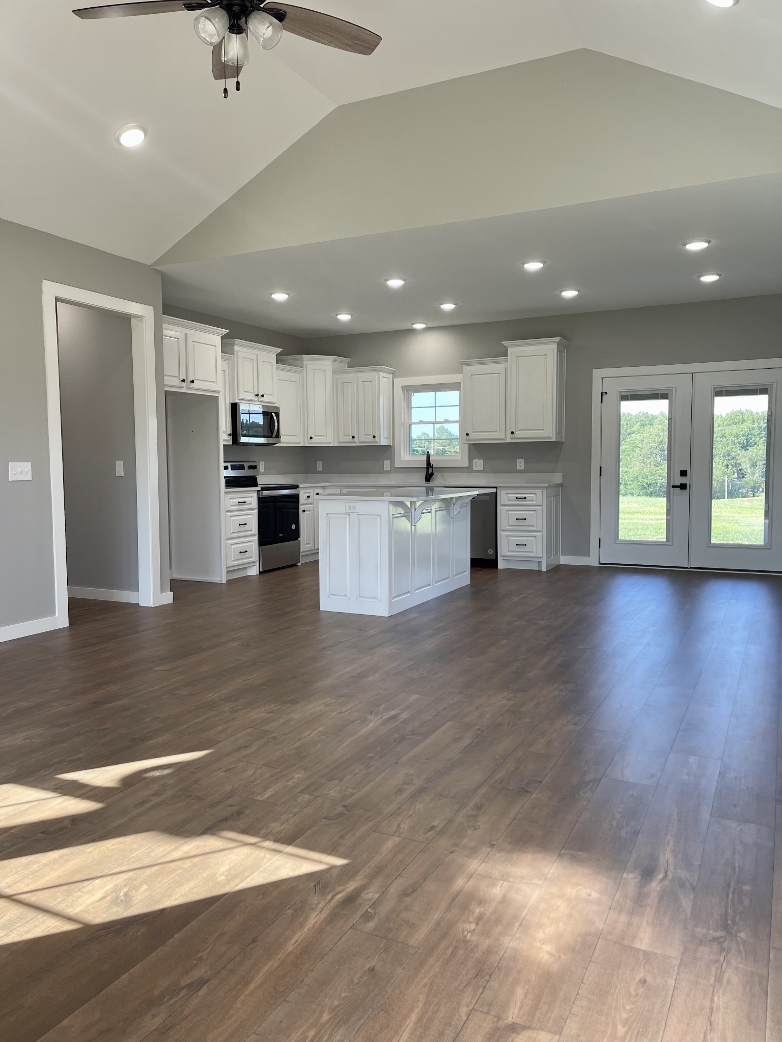 1460 Fall River Road Lawrenceburg, TN 38464 - Photo 3 of 31 a view of kitchen with kitchen island a sink wooden floor and stainless steel appliances