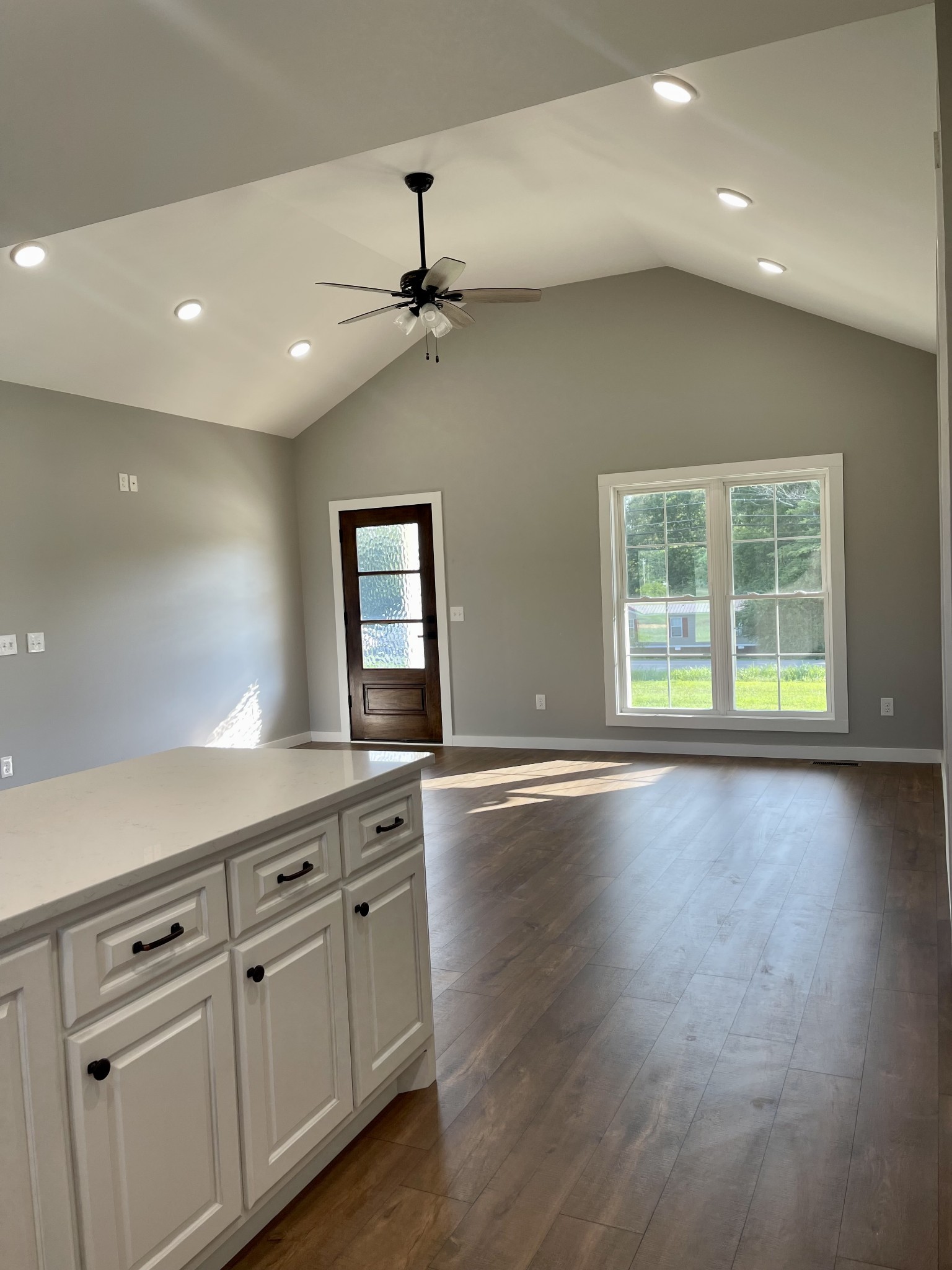 1460 Fall River Road Lawrenceburg, TN 38464 - Photo 9 of 31 a view of an empty room with a window and wooden floor