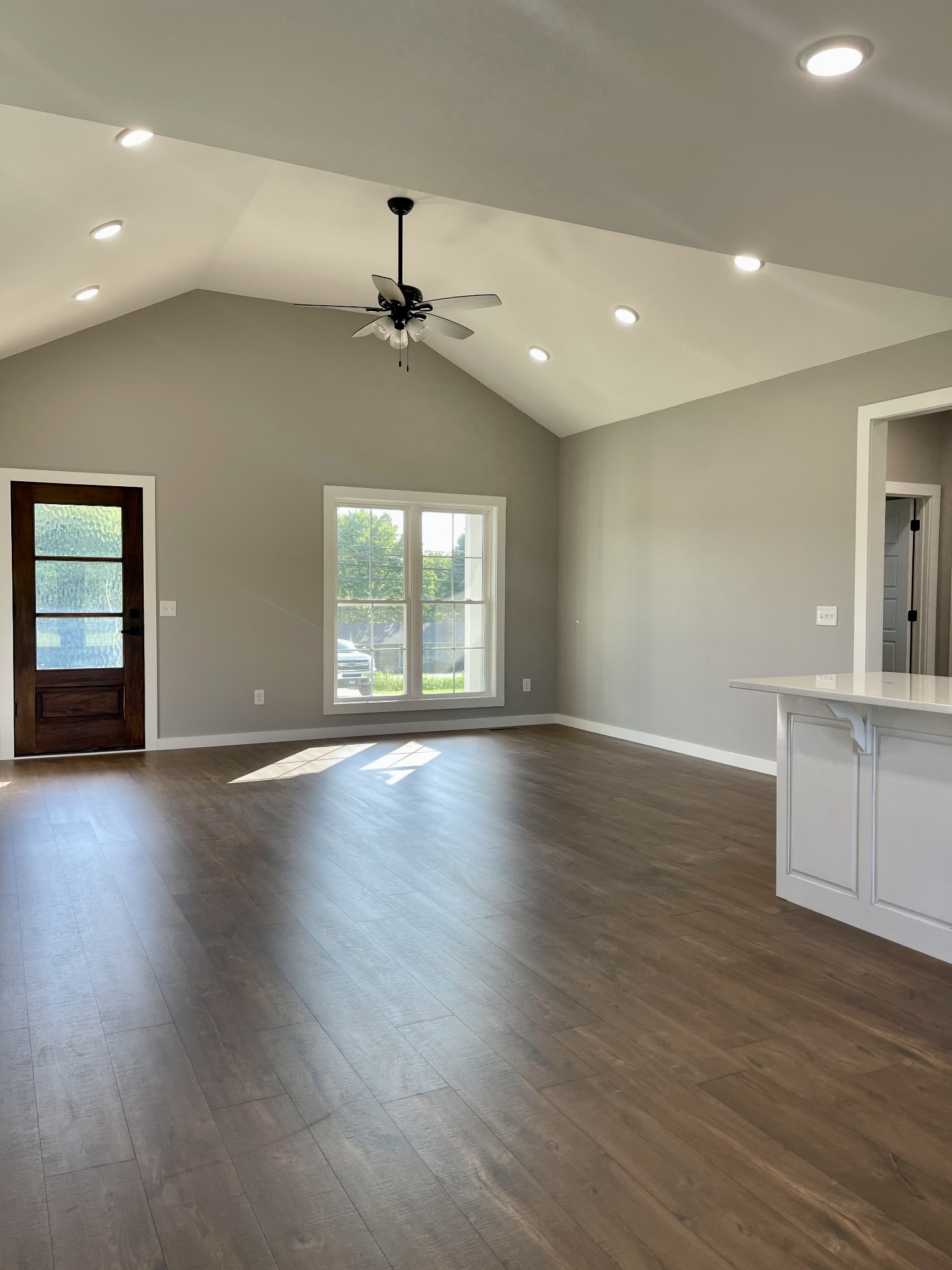 1460 Fall River Road Lawrenceburg, TN 38464 - Photo 10 of 31 an empty room with wooden floor and windows