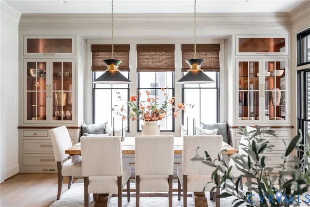 a dining room with furniture and window