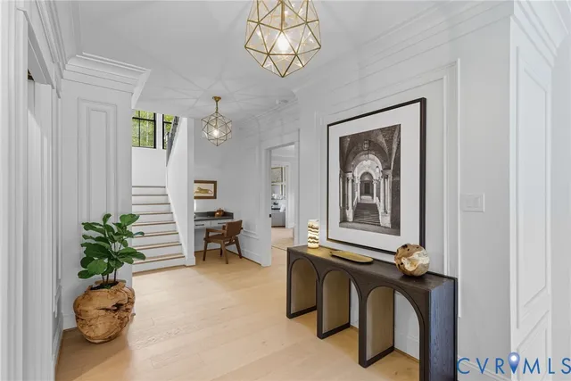 a living room with furniture and flowers