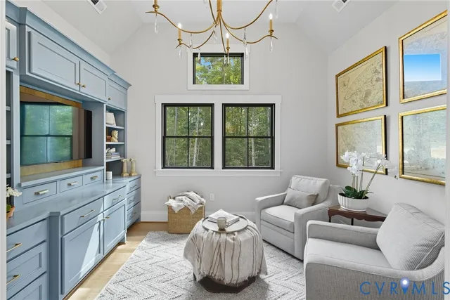 a living room with furniture and windows