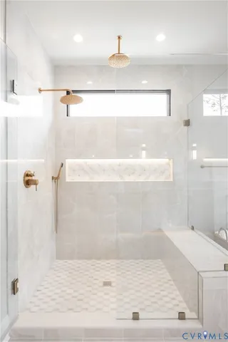 a bathroom with a sink vanity and mirror