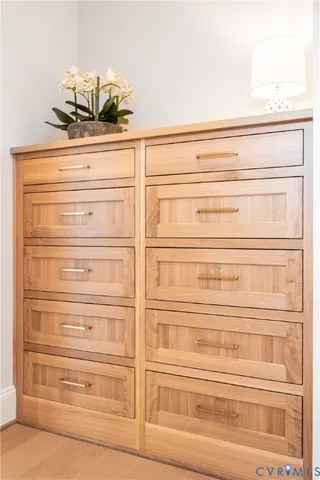 a bedroom with a bed couch and window