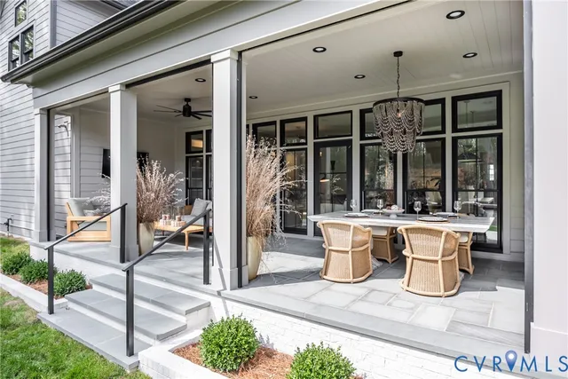 a view of a patio with table and chairs