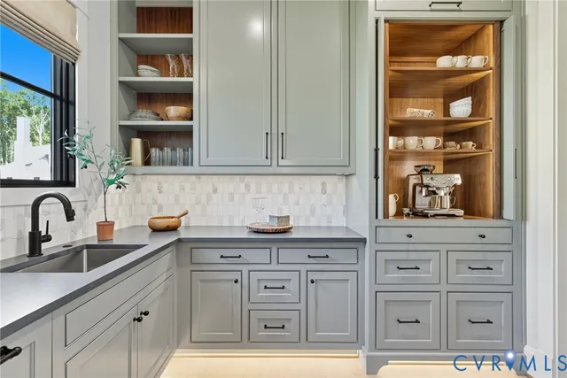 a kitchen with stainless steel appliances granite countertop a sink and cabinets