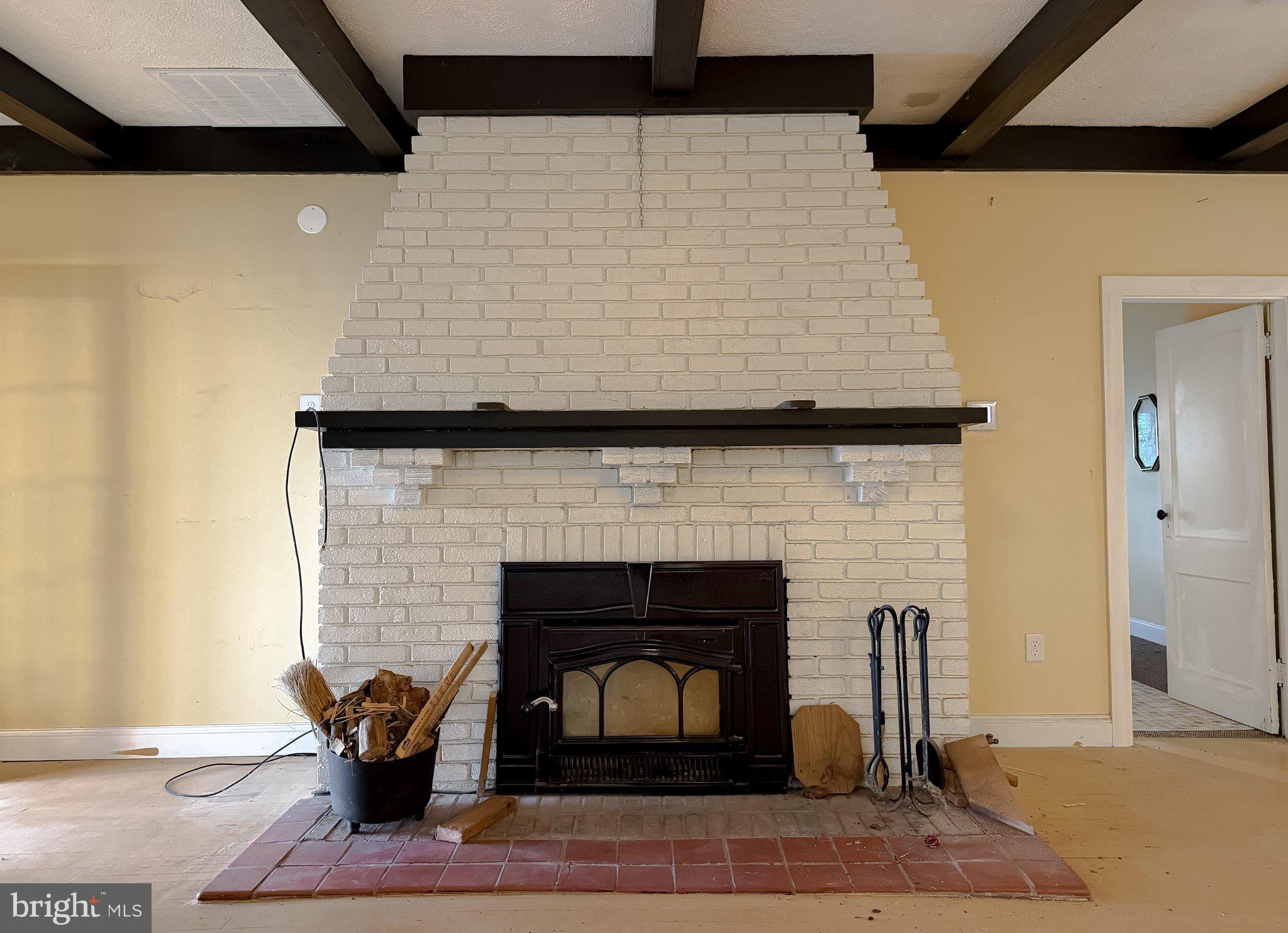 42195 White Point Beach Road Leonardtown, MD 20650 - Photo 41 of 57 Charming fireplace with rustic appeal.