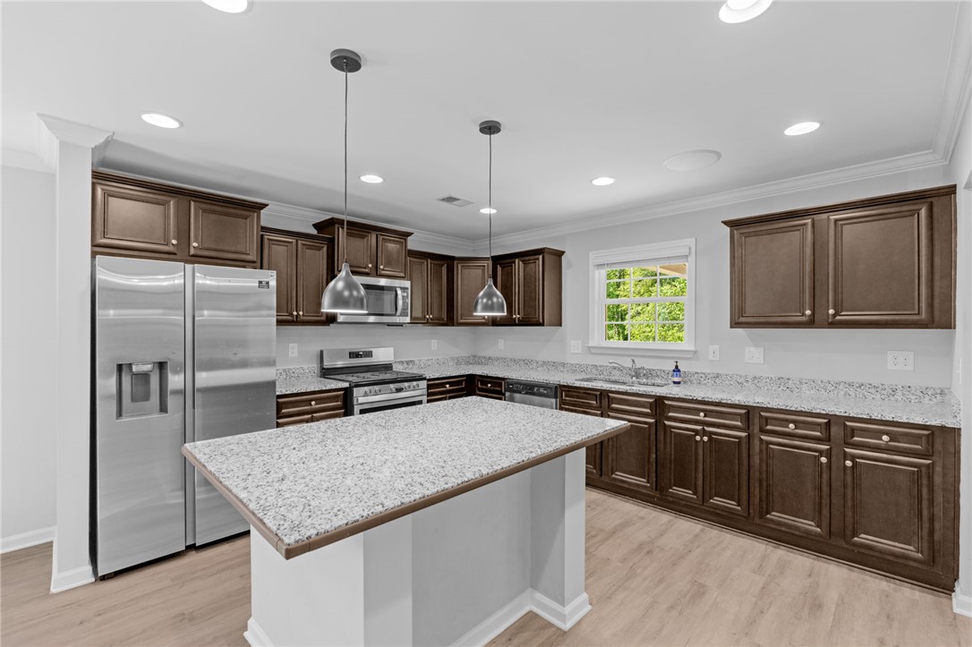 1237 Madden Bridge Road Central, SC 29630 - Photo 14 of 46 This thoughtfully designed kitchen offers a practical layout for effortless culinary pursuits.