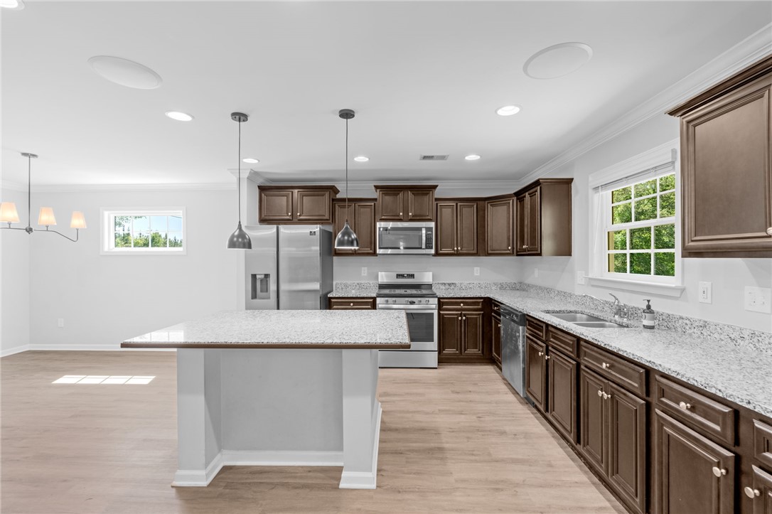 1237 Madden Bridge Road Central, SC 29630 - Photo 15 of 46 This bright kitchen features ample counter space, rich cabinetry, and modern stainless steel appliances.