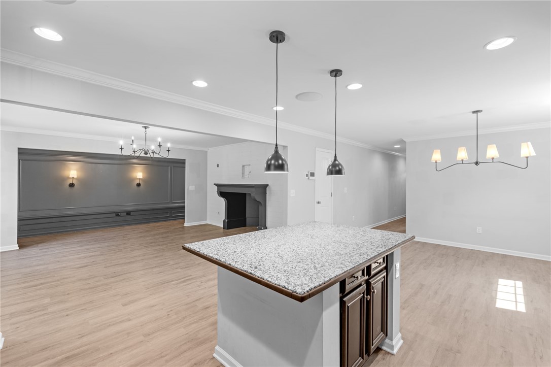 1237 Madden Bridge Road Central, SC 29630 - Photo 17 of 46 This expansive space features an inviting kitchen island and sophisticated lighting throughout.
