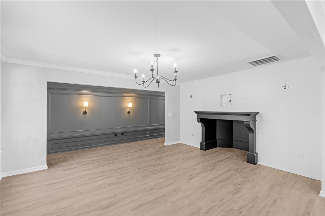 1237 Madden Bridge Road Central, SC 29630 - Photo 18 of 46 This expansive room offers an inviting atmosphere with natural light and a classic fireplace.