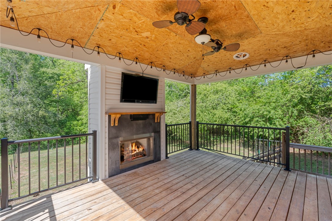 1237 Madden Bridge Road Central, SC 29630 - Photo 23 of 46 This spacious outdoor area features a cozy fireplace, perfect for relaxation and entertainment.