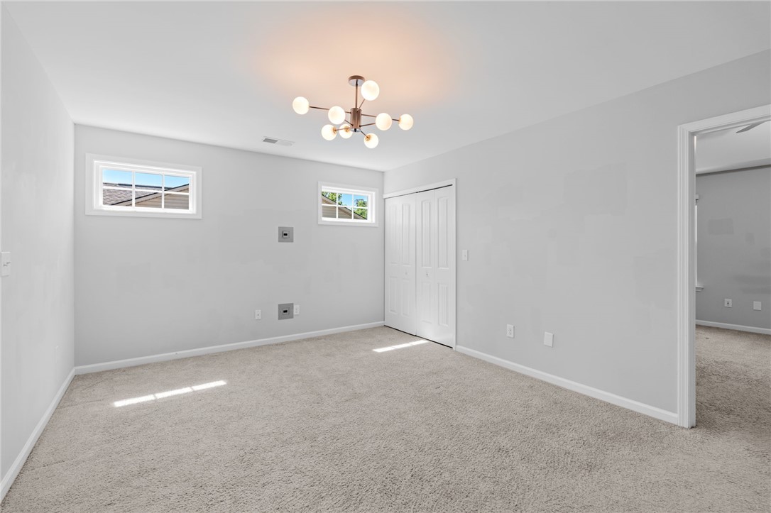 1237 Madden Bridge Road Central, SC 29630 - Photo 27 of 46 This bright room features abundant natural light and soft carpeting, creating a comfortable living space.