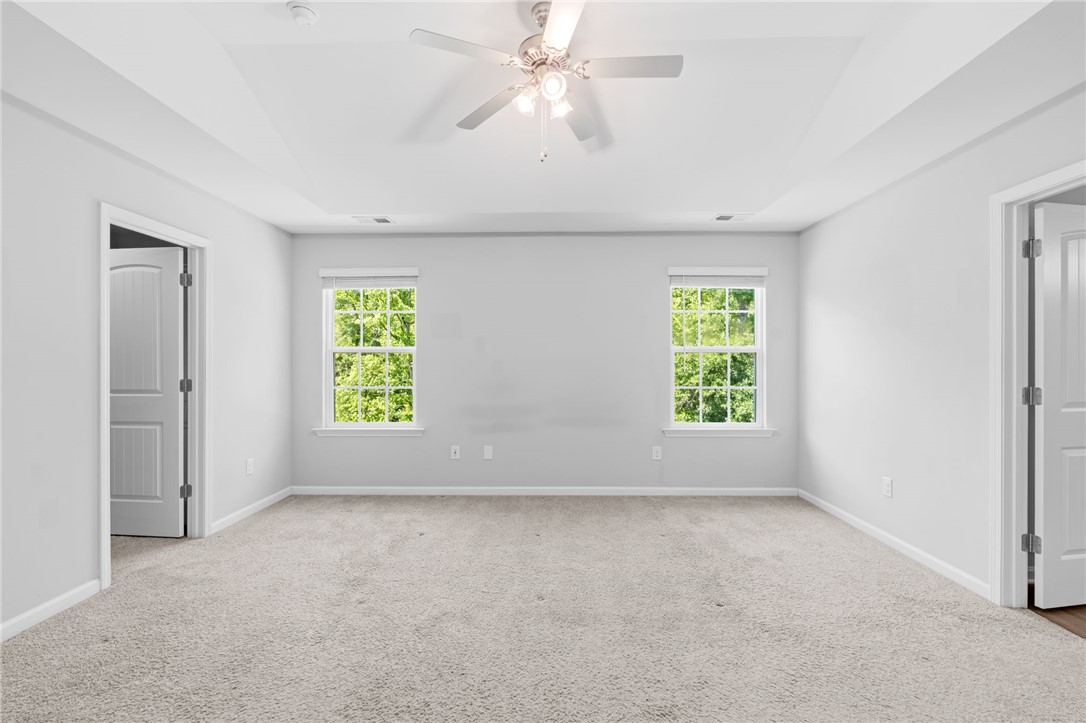 1237 Madden Bridge Road Central, SC 29630 - Photo 29 of 46 This airy bedroom offers a serene retreat with ample natural light.