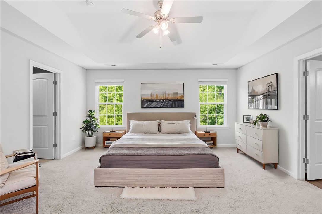 1237 Madden Bridge Road Central, SC 29630 - Photo 30 of 46 Bright and airy sleeping area featuring large windows and comfortable carpeting.