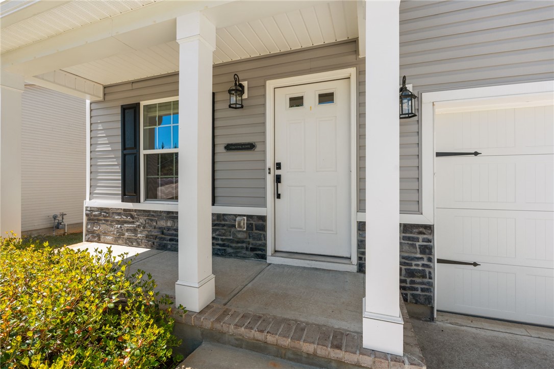 1237 Madden Bridge Road Central, SC 29630 - Photo 4 of 46 This charming home showcases a welcoming front entrance with classic architectural details.
