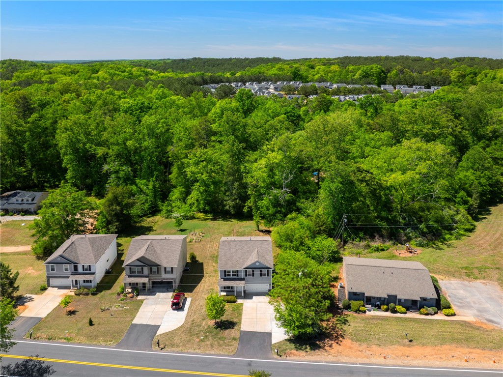 1237 Madden Bridge Road Central, SC 29630 - Photo 41 of 46 An aerial view showcases new homes nestled beside lush, expansive greenery.