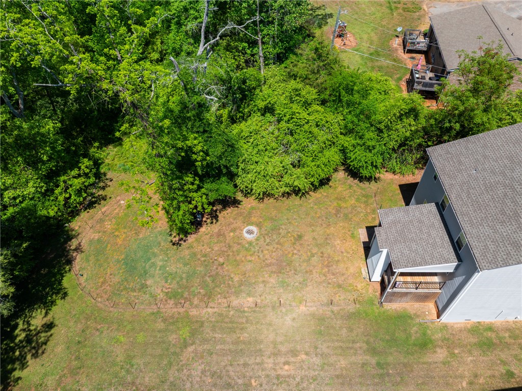 1237 Madden Bridge Road Central, SC 29630 - Photo 43 of 46 This spacious yard offers a serene retreat with natural surroundings and a private fire pit.