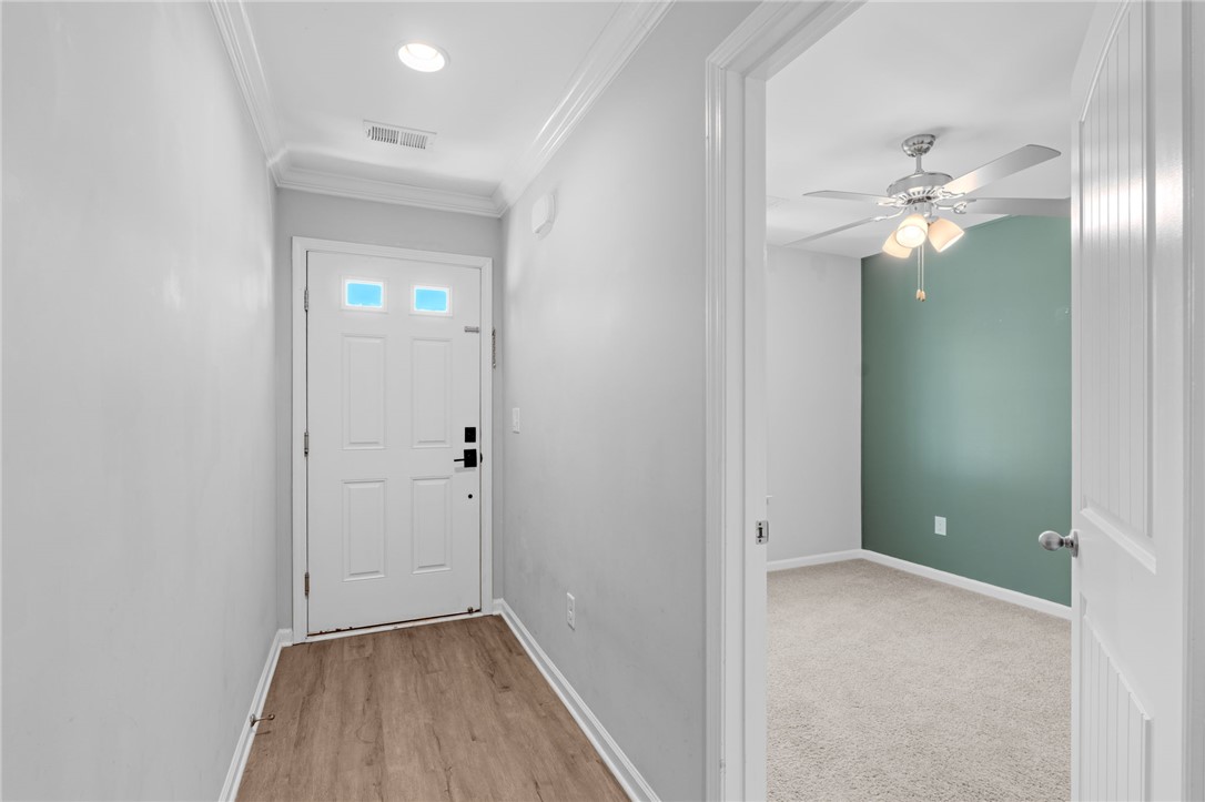 1237 Madden Bridge Road Central, SC 29630 - Photo 5 of 46 This entry showcases durable flooring and offers a glimpse into an adjacent space.