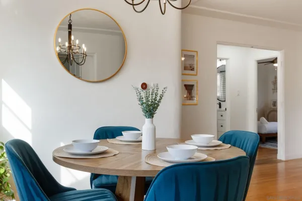 a dining room with furniture and wooden floor