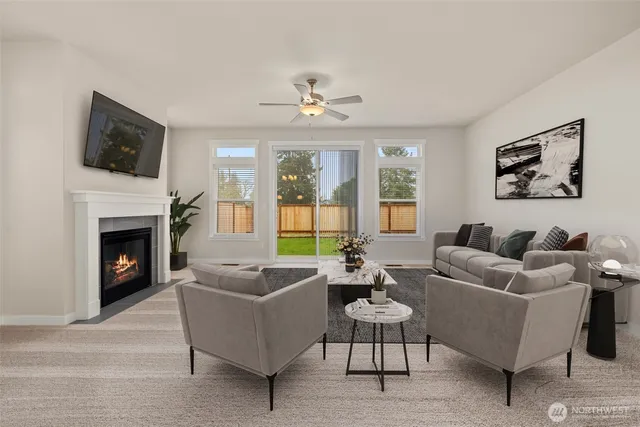 a living room with furniture fireplace and window