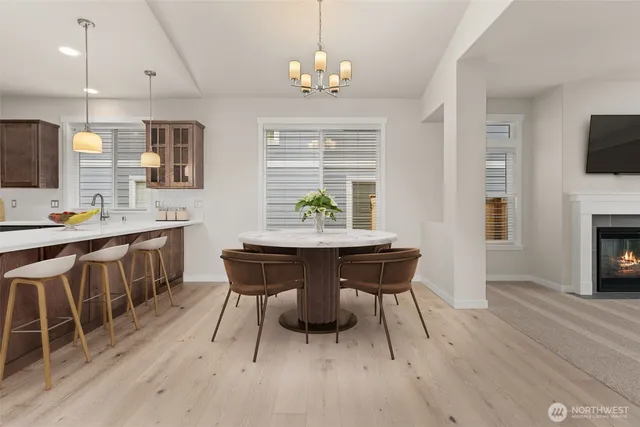 a view of a dining room with furniture window and wooden floor