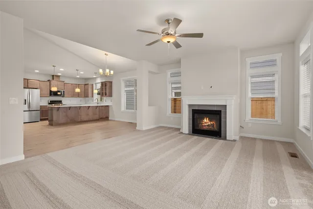 a view of a kitchen with furniture and a fireplace