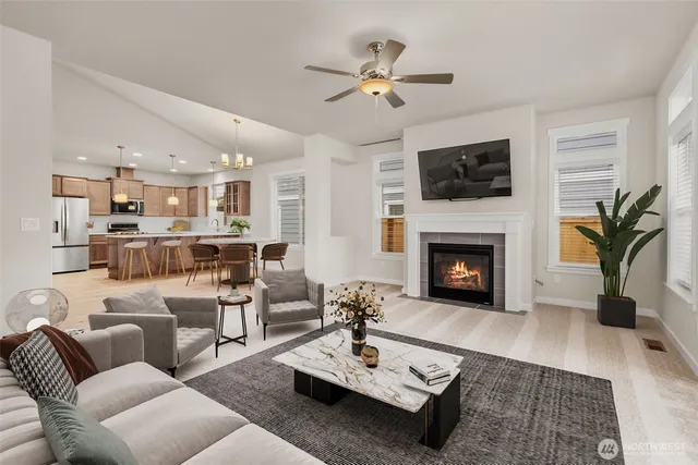 a living room with furniture fireplace and a flat screen tv