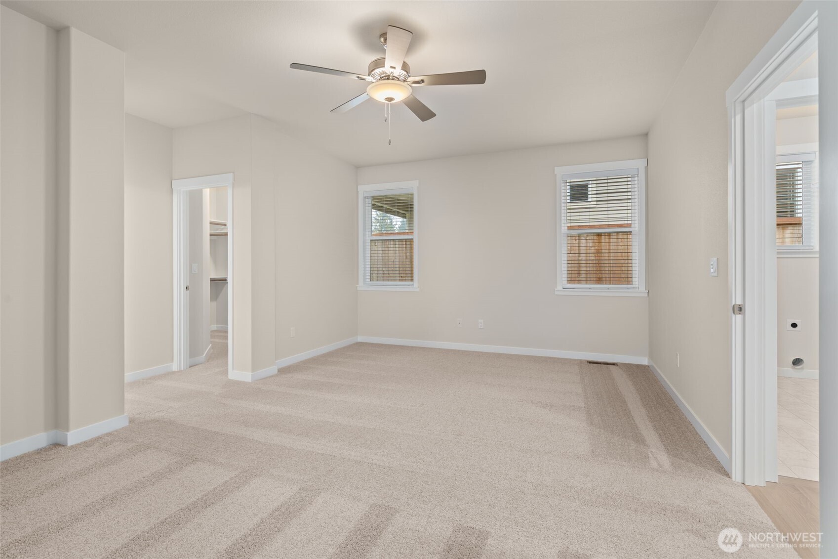 719 Maggee Street Southeast Lacey, WA 98513 - Photo 20 of 40 an empty room with chandelier fan and windows