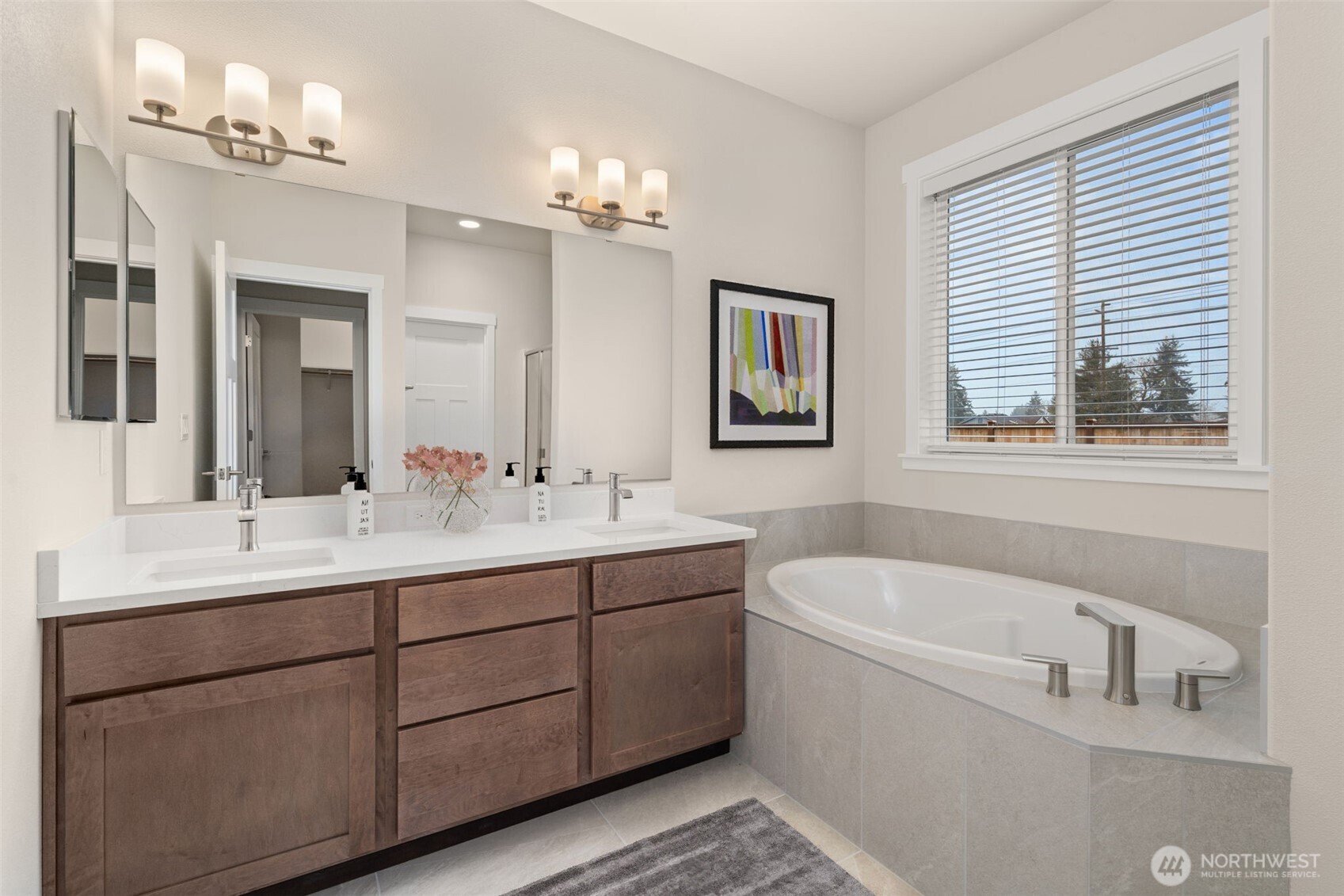 719 Maggee Street Southeast Lacey, WA 98513 - Photo 23 of 40 a bathroom with a tub a sink and mirror