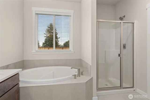 a white bath tub sitting next to a window