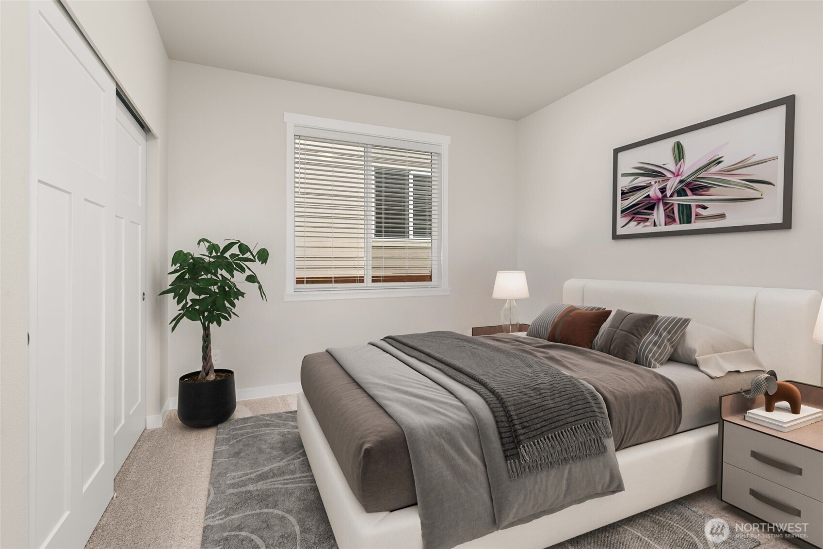 719 Maggee Street Southeast Lacey, WA 98513 - Photo 28 of 40 a bedroom with a bed and a potted plant