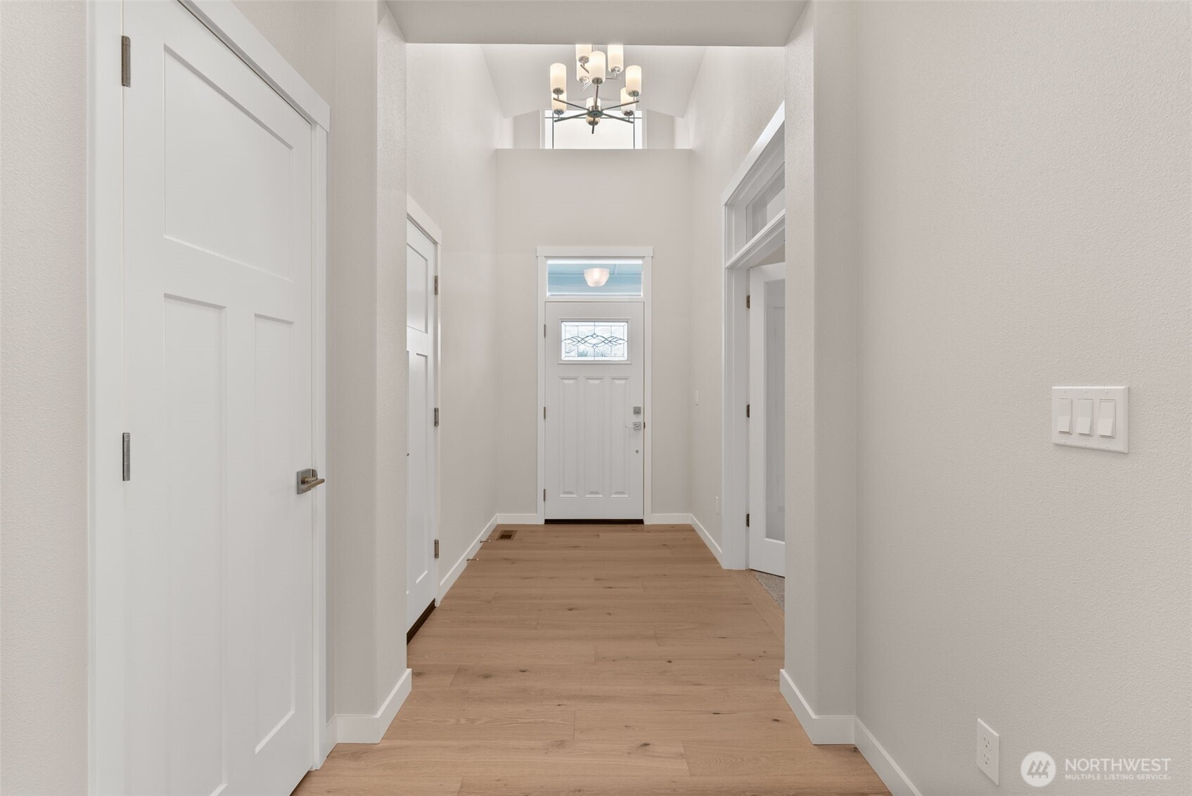 719 Maggee Street Southeast Lacey, WA 98513 - Photo 6 of 40 a view of a hallway with wooden floor