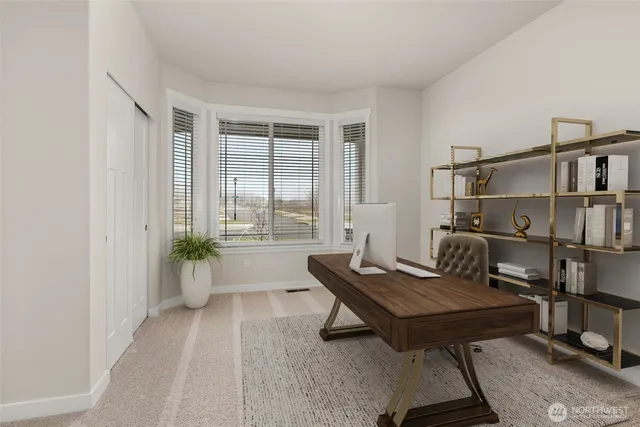 a living room with furniture a rug and a window