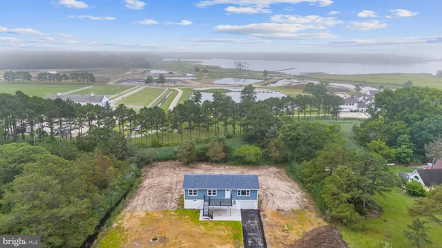 an aerial view of a house with a garden