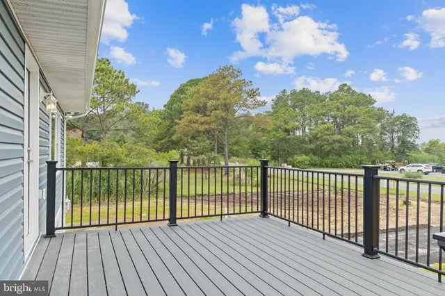 a view of a balcony with wooden floor