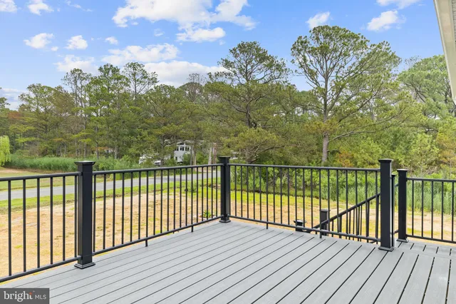 a view of balcony with wooden floor