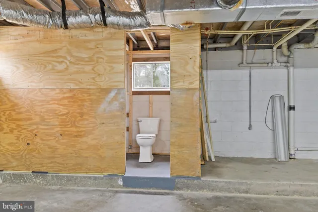 a bathroom with a toilet a sink and a shower