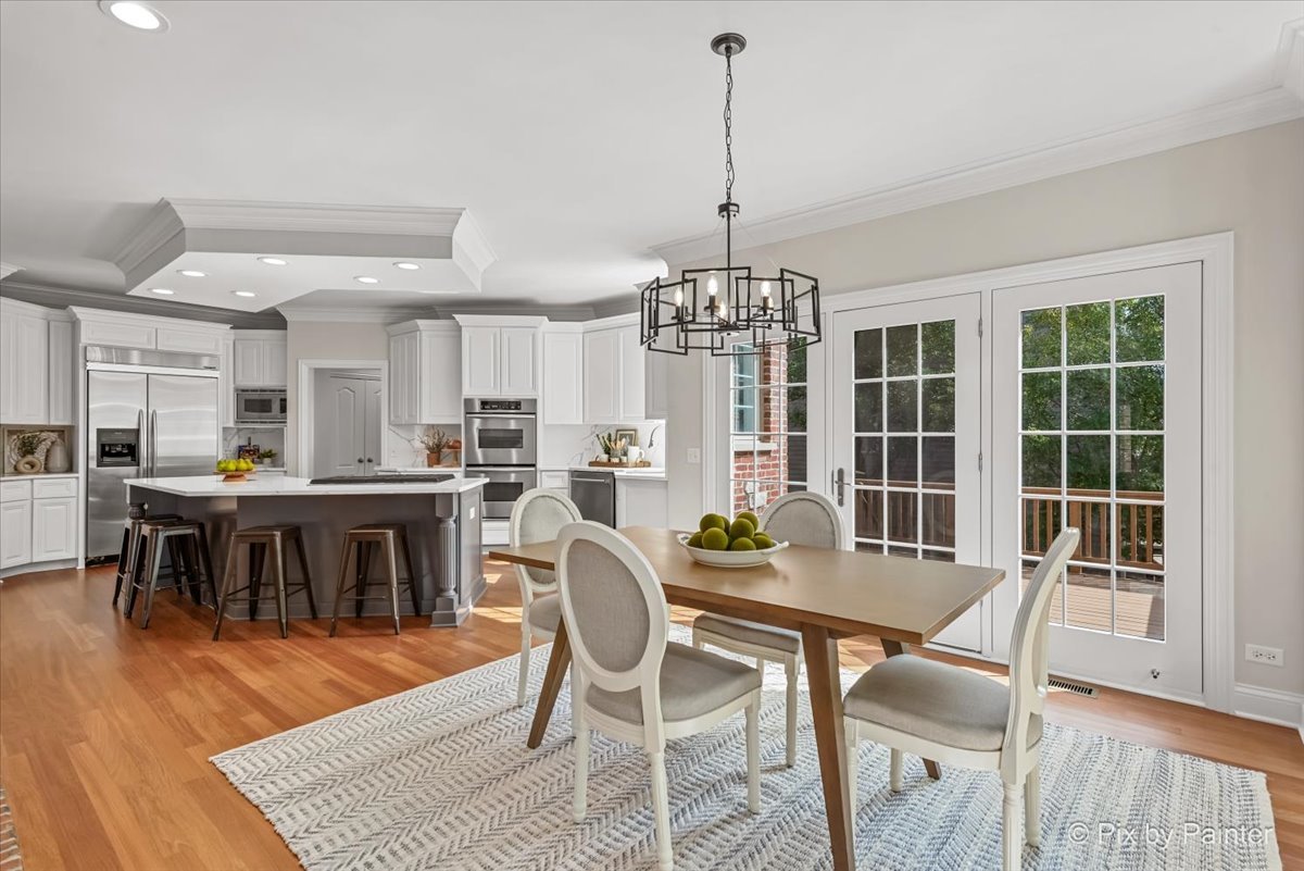 39W599 Walt Whitman Road St. Charles, IL 60175 - Photo 15 of 74 a view of a dining room with furniture window and wooden floor