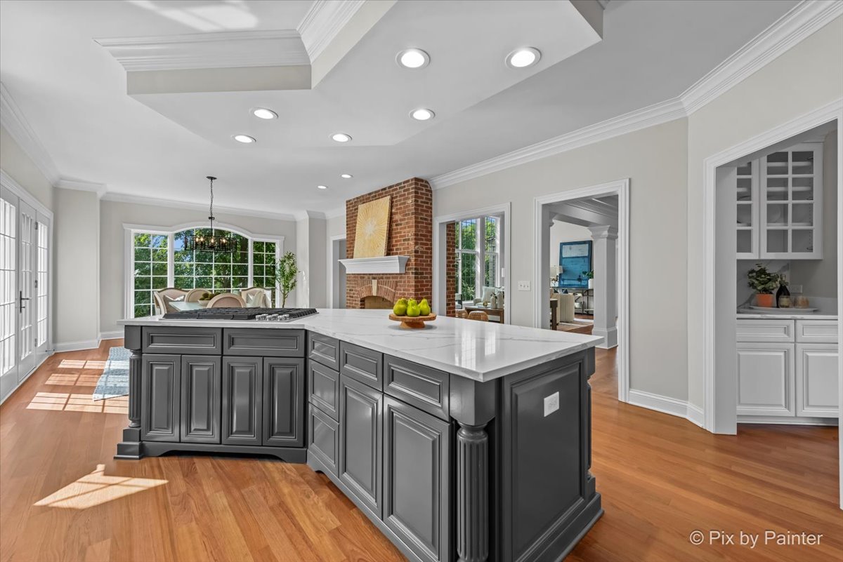 39W599 Walt Whitman Road St. Charles, IL 60175 - Photo 18 of 74 a kitchen with a sink and wooden floor