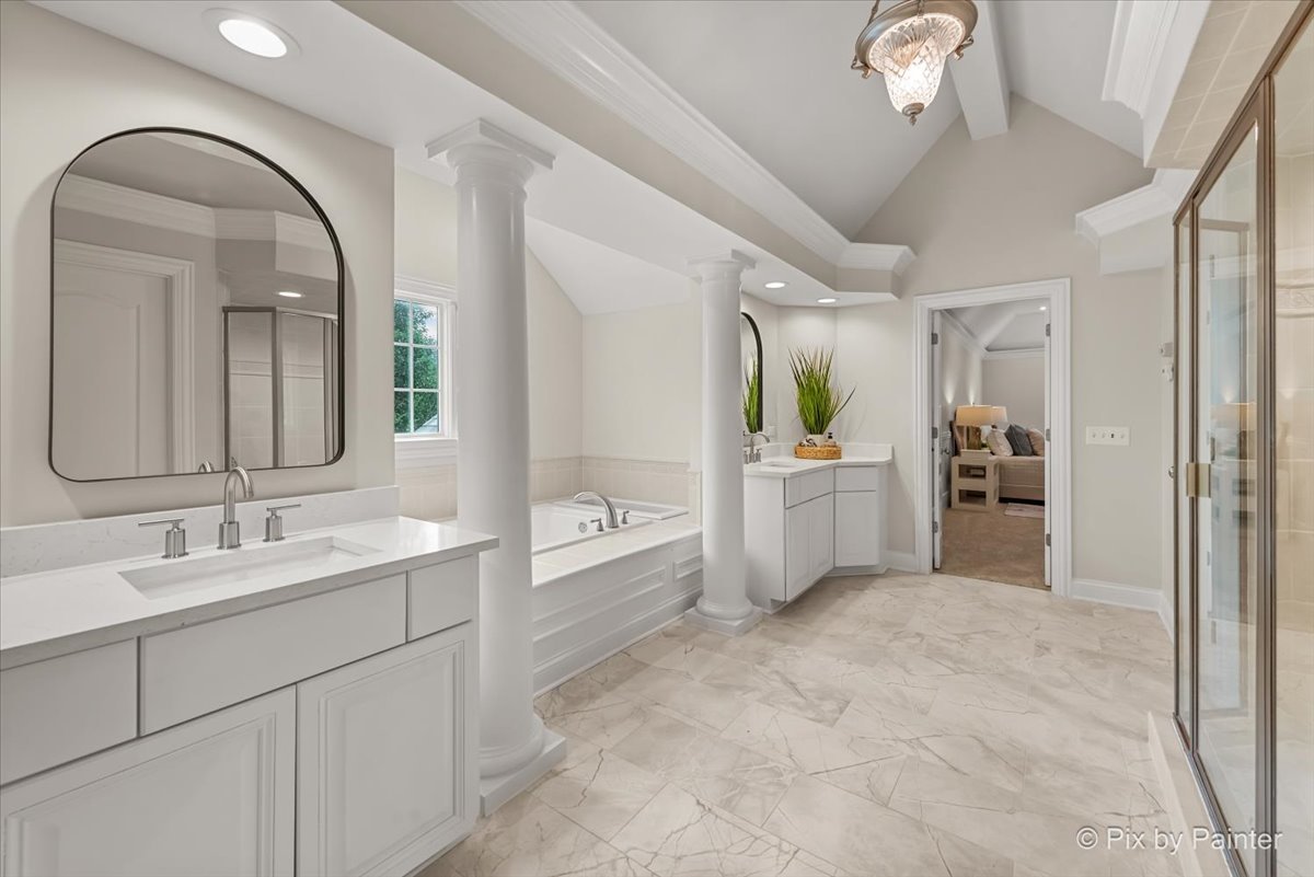 39W599 Walt Whitman Road St. Charles, IL 60175 - Photo 26 of 74 a spacious bathroom with a sink a mirror and a bathtub