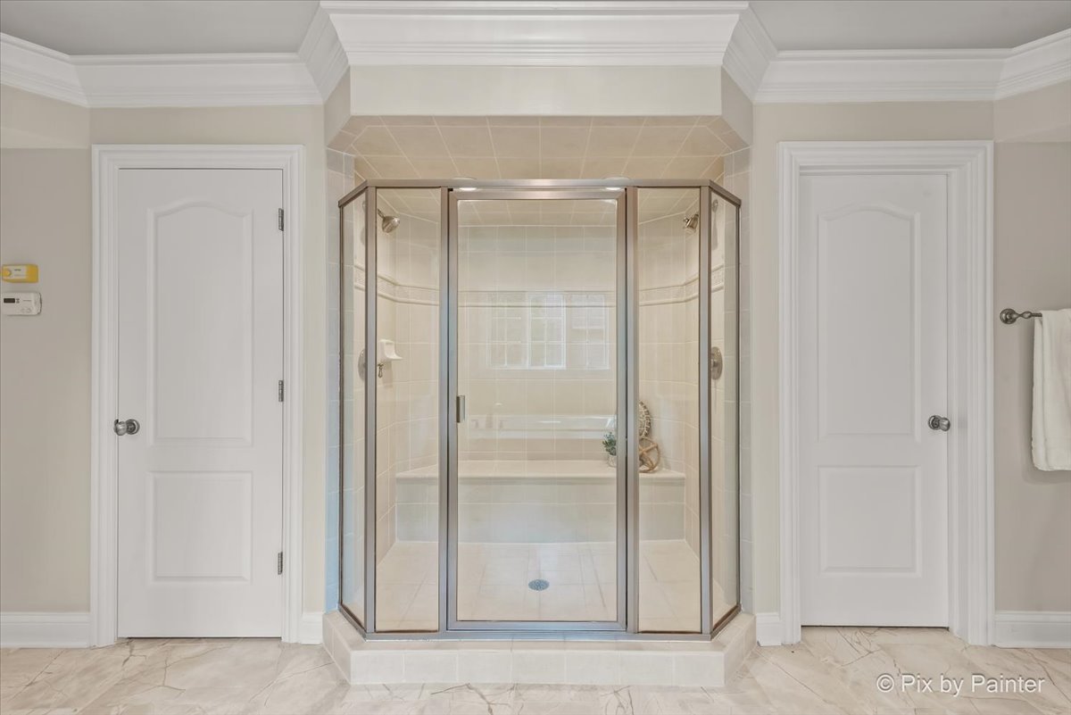 39W599 Walt Whitman Road St. Charles, IL 60175 - Photo 27 of 74 a bathroom with a glass shower door