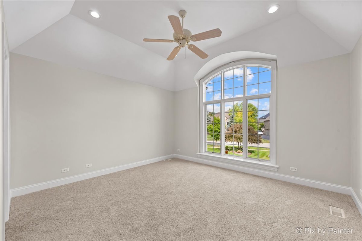 39W599 Walt Whitman Road St. Charles, IL 60175 - Photo 32 of 74 an empty room with windows and ceiling fan