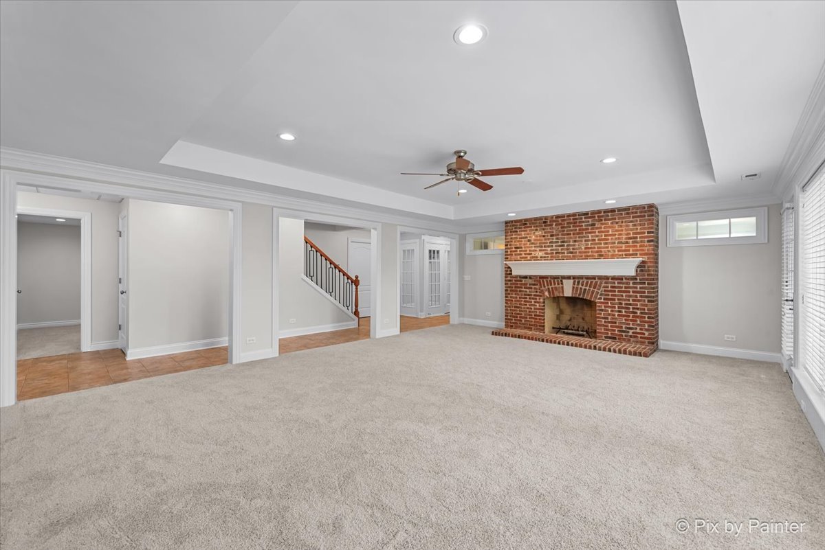 39W599 Walt Whitman Road St. Charles, IL 60175 - Photo 38 of 74 a view of an empty room with a fireplace and a window